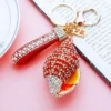 Luxury Diamond Encrusted Pearl Conch Metallic Keychain - Thumbnail Image 2
